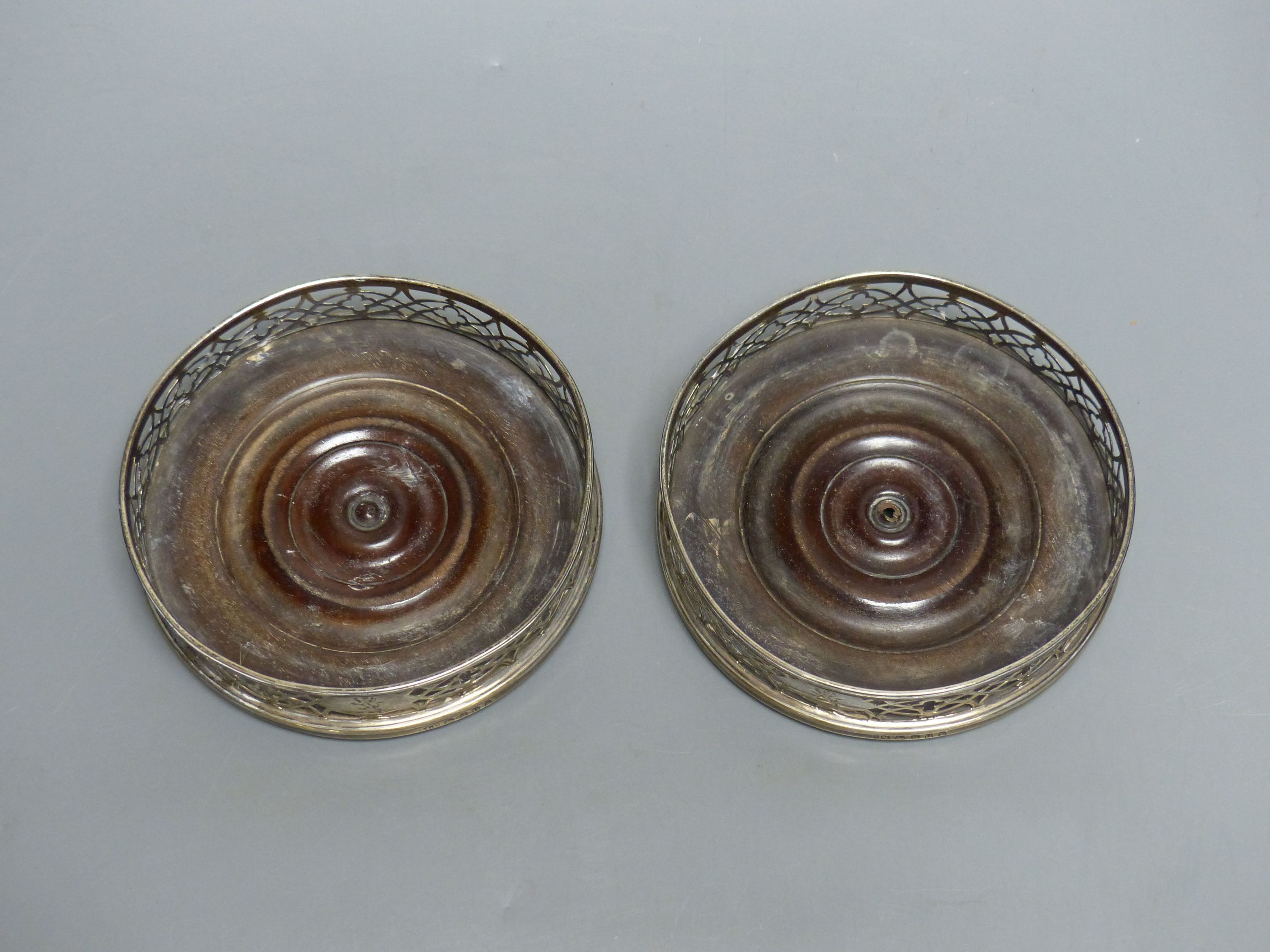 A pair of George III silver bottle coasters Dia 12.5cm